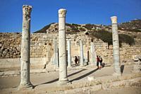 Tourists near the Stoa and Heroon Of Symmachos at Knidos the ancient Greek city ruins, Datca Peninsula, Mugla Province, Aegean Region, Turkey, Europe.