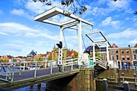 Gravestenenbrug Drawbridge Bridge for pedestrians and bicycles on the River Spaarne in Haarlem Amsterdam Netherlands near the Teyler Museum.