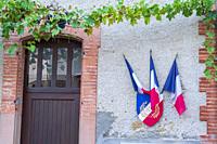 flags of the republic on a facade, Vals, Midi-Pyrénées, Ariège department, French Republic, Europe.