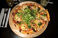 A vegetarian pizza with arugula.