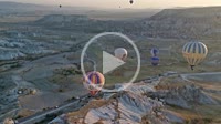 Hot air balloons flying with tourists over Cappadocia, Turkey. Türkiye.