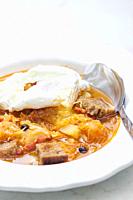 cabbage soup with poached egg.