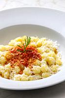 gnocchi with tomato sauce and parmesan cheese.