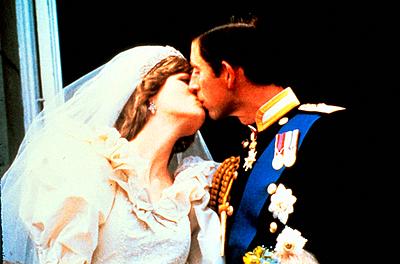 Prince Charles, Prince of Wales and Diana, Princess of Wales kiss on the balcony of Buckingham Palace following their wedding on 29 July 1981.  29th July 1981 - A worldwide television audience of over 700 million people watch the wedding of Charles, Prince of Wales, and Lady Diana Spencer at St Paul's Cathedral in London.-stock-photo