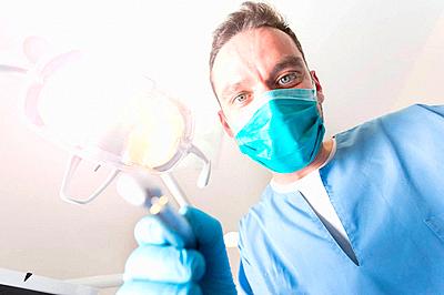 Point of View from patient of a dentist at work-stock-photo