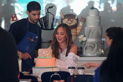 Chrissy Teigen prepares her daughter's first birthday cake Featuring: Chrissy Teigen Where: West Hollywood, California, United States When: 01 Apr 201...-stock-photo