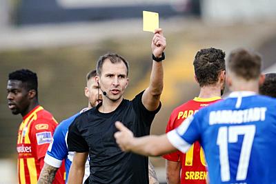 08 November 2020, Hessen, Darmstadt: Football: 2nd Bundesliga, SV Darmstadt 98 - SC Paderborn 07, 7th day of play, Merck Stadium at the Böllenfalltor. Referee Florian Heft shows the yellow card. Photo: Uwe Anspach/dpa - IMPORTANT NOTE: In accordance with the regulations of the DFL Deutsche Fußball Liga and the DFB Deutscher Fußball-Bund, it is prohibited to exploit or have exploited in the stadium and/or from the game taken photographs in the form of sequence images and/or video-like photo series. - Darmstadt/Hessen/Germany-stock-photo