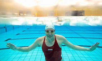 10 November 2020, Lower Saxony, Hanover: Swimmer Angelina Köhler smiles under water at the Olympic base in Lower Saxony during a training session. Photo: Julian Stratenschulte/dpa. - Hanover/Lower Saxony/Germany-stock-photo