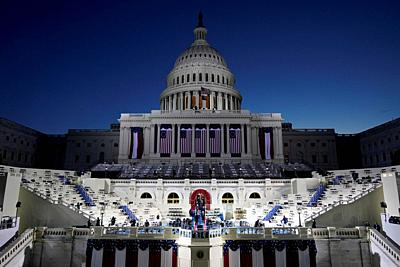 The U.S. Capitol and stage are lit as the Sun begins to rise before events get underway before the 59th Presidential Inauguration at the U.S. Capitol in Washington, Wednesday, Jan. 20, 2021. .Credit: Patrick Semansky / Pool via CNP | usage worldwide. - Washington/District of Columbia/United States of America-stock-photo