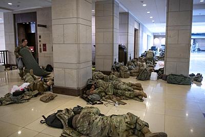 Members of the National Guard sleep in the Capitol Visitors Center at the US Capitol, the day after the inauguration of President Joe Biden in Washington, DC on Thursday, January 21, 2021. .Credit: Rod Lamkey / Pool via CNP | usage worldwide. - Washington/District of Columbia/United States of America-stock-photo