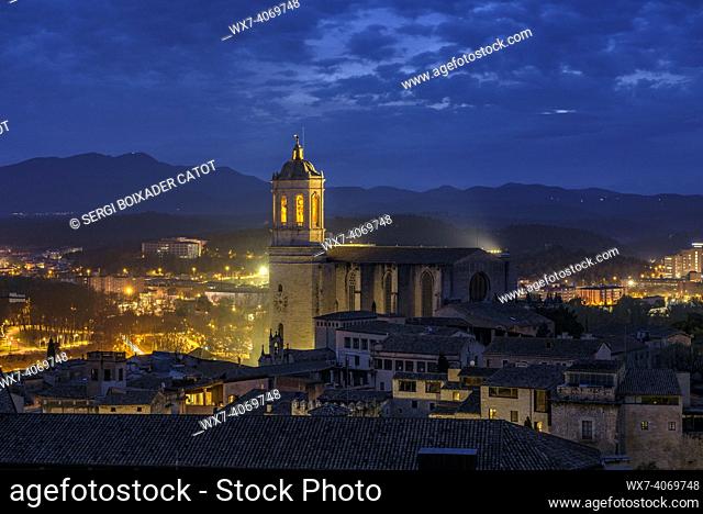 Girona Cathedral seen from the Sant Domènec tower in the wall of Girona, at twilight and night (Girona, Catalonia, Spain)