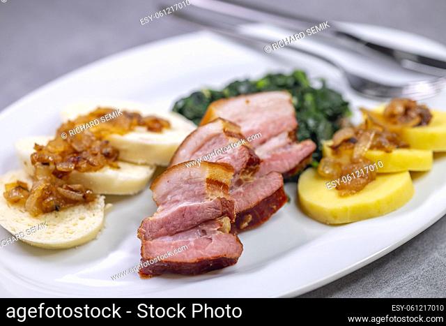 smoked flank with potato and bread dumplings and spinach