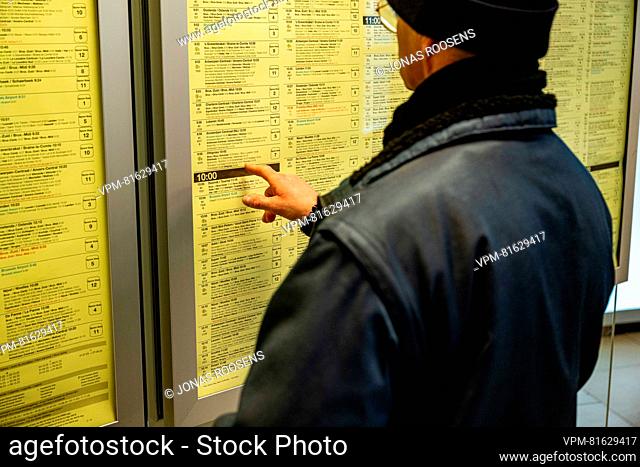 A man checks a timetable during a 48 hour strike of Belgian railway company NMBS-SNCB, organized by unions SLFP Cheminots-VSOA Spoor, CGSP Cheminots-Acod Spoor