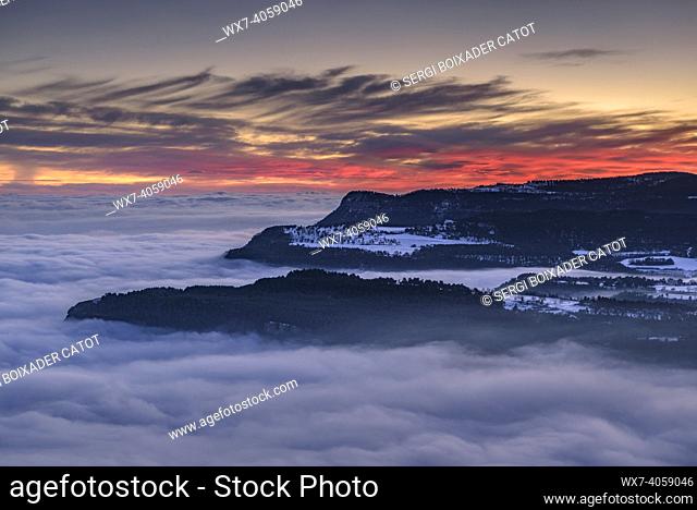 Capolat high plateau and Les Tres Maries mountains in a winter sunset with a sea of clouds over the central region of Catalonia (Berguedá , Catalonia, Spain