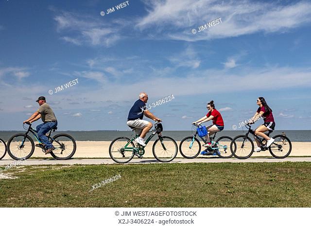 Oregon, Ohio - People ride bicycles on a path next to Lake Erie at Maumee Bay State Park