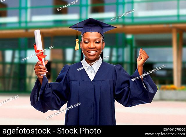 happy female graduate student with diploma