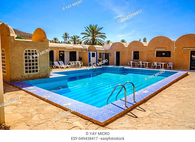 Fresh blue swimming pool in Hotel, Sahara desert, Tunisia, North Africa