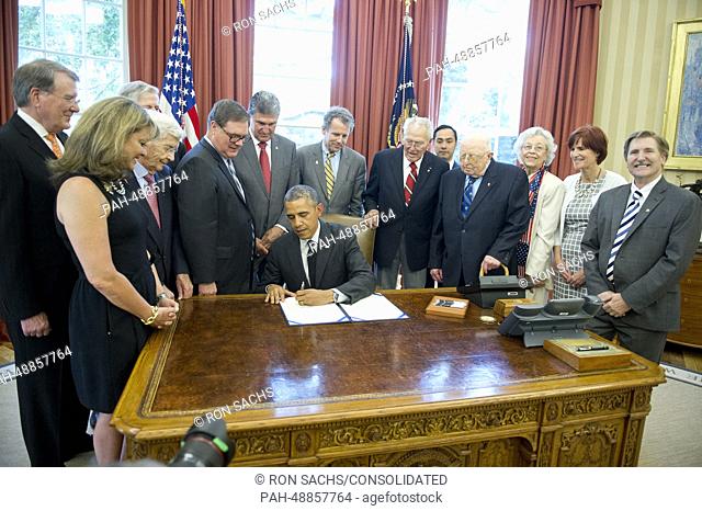 United States President Barack Obama signs H.R. 685, the ""American Fighter Aces Congressional Gold Medal Act, "" which provides for the award of a single...