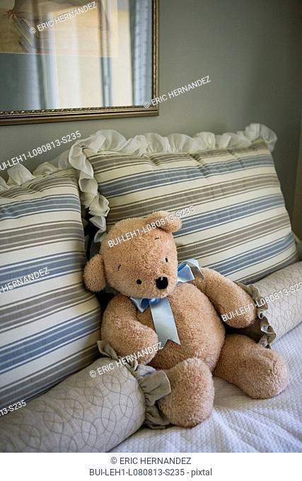 Stuffed bear on bed