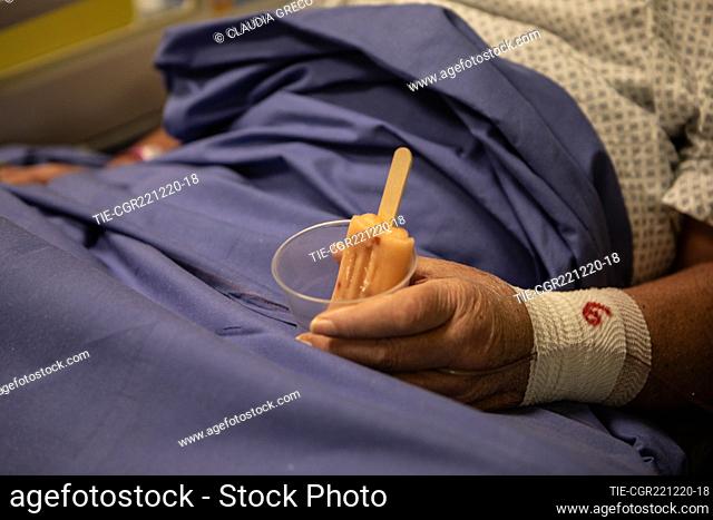 A patient holds a popsicle in his hand in the Covid intensive care ward, built in the former sports center of the San Raffaele Hospital with the fundraising...