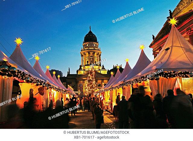 Christmas Market at the Gendarmenmarkt, here with the German Dome (in background) and the Konzerthaus (right), Berlin, Germany