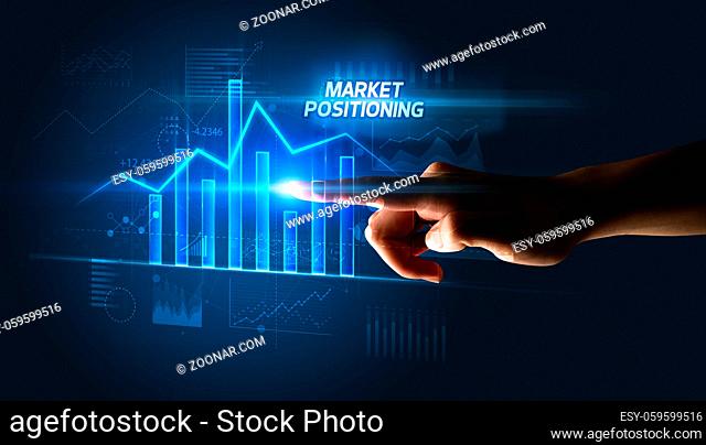 Hand touching MARKET POSITIONING button, business concept