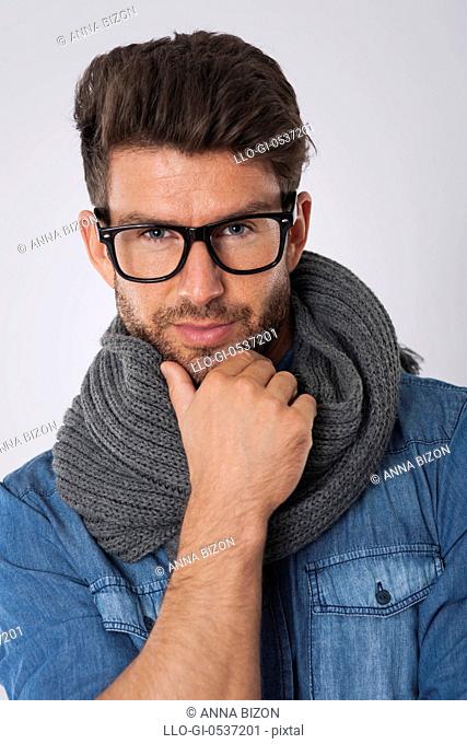 Handsome man with fashion glasses and scarf. Debica, Poland