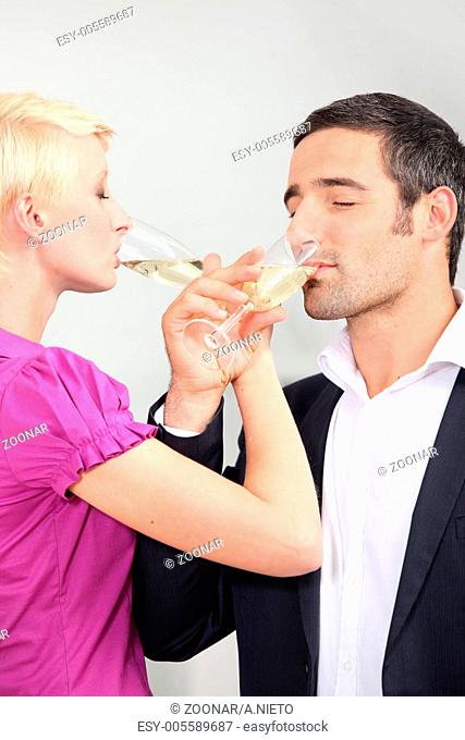 man and woman drinking champagne with love