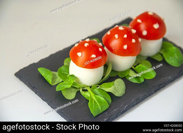 Pincho made of eggs and tomato as Amanita muscaria mushrooms. Spain