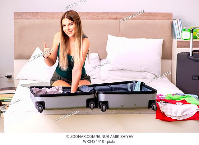 Young woman getting ready for summer vacation