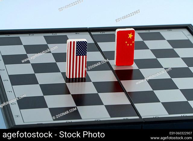 Symbols of the flag of the USA and China on the chessboard. The concept of political game