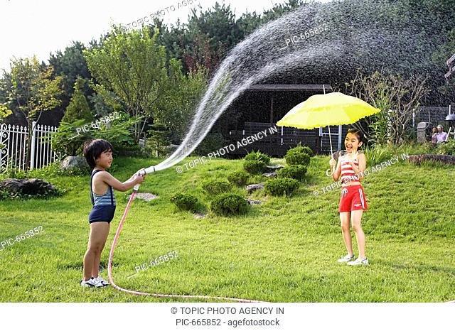 Korean Kids Playing With Water