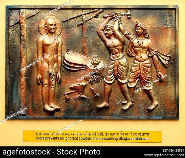 Indra prevents an ignorant cowherd from assaulting Bhagavan Mahavira, Street bas relief on the wall of Jain Temple (also called Parshwanath Temple) in Kolkata
