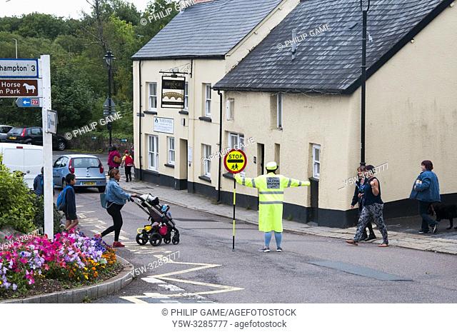 School crossing supervisor at work in Hatherleigh, North Devon, England