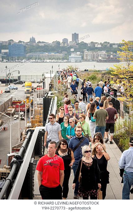 Visitors promenade on the third and final phase of the popular High Line Park, from West 30th Street to West 34th Street, in New York