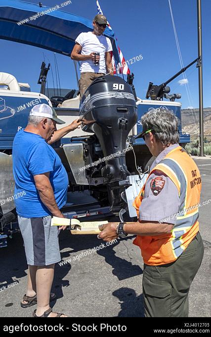 Gunnison, Colorado - Carol Soell, a boat inspector at Curecanti National Recreation Area, checks boats entering and leaving Blue Mesa Reservoir for invasive...