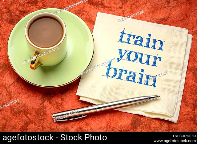 train your brain motivational note - handwriting on a napkin with coffee, mental health and personal development concept