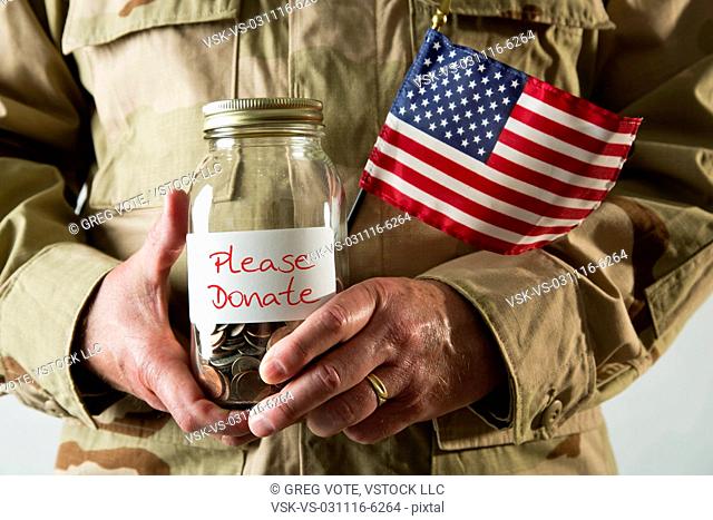 Marine holding american flag and jar
