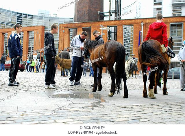 Republic of Ireland, Dublin, Smithfield Horse Market, Youngsters on horseback at Smithfield Horse Market in Dublin