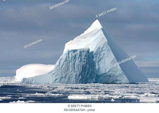 Iceberg in ice floe in the southern ocean, 180 miles north of East Antarctica, Antarctica
