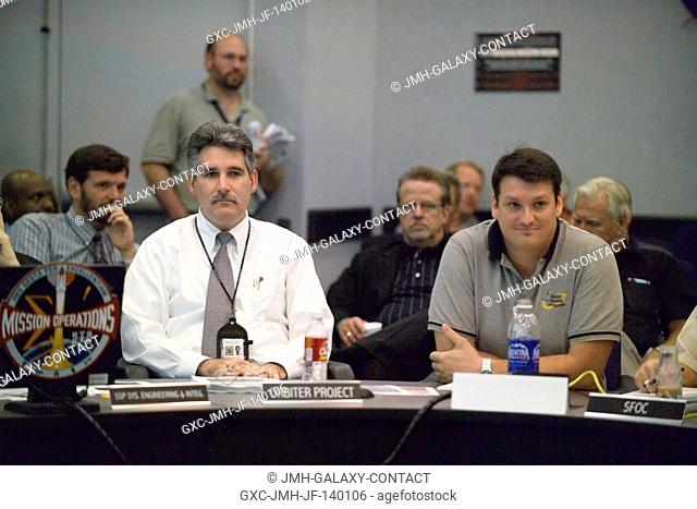 Steve M. Poulos, Jr. (left), Manager, Space Shuttle Vehicle Engineering Office; and Justin Kerr, Impact Test Director, Space Shuttle Program Office