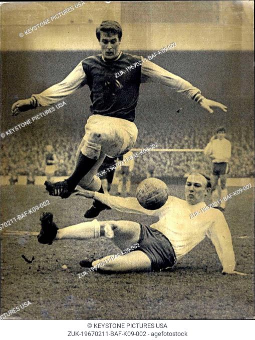 Feb. 11, 1967 - Westham versus Sunderland at Upton Park: Photo shows Geoff Hurst of West Ham, leaps over Cecil Irwin, of Sunderland