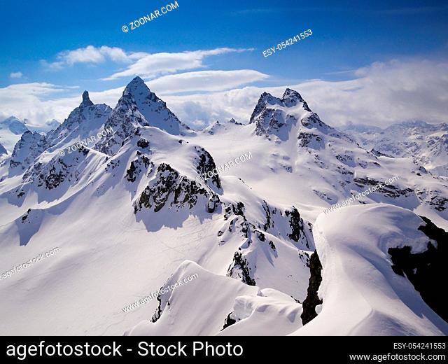 gorgeous mountain landscape in deep winter with impressive peaks in the Alps near Klosters in the Swiss Alps