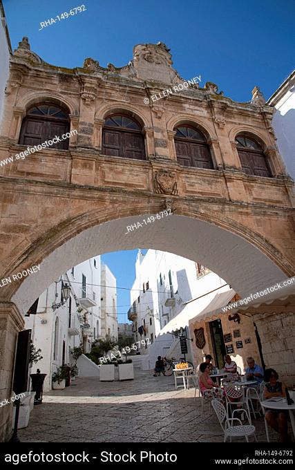 A Baroque style arch in the Centro Storico of the medieval city of Ostuni, Puglia, Italy, Europe