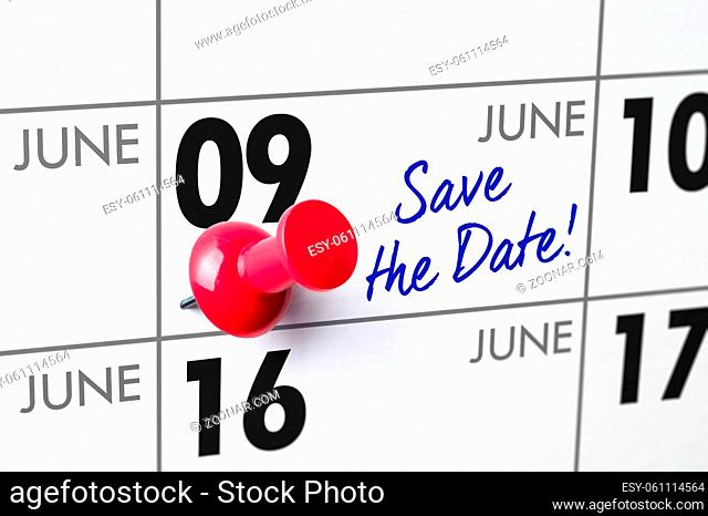 Wall calendar with a red pin - June 09