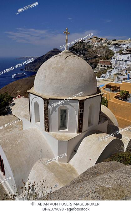 View from the rim across the rooftops of Firá or Thira into the Caldera, Ágios Ioánnis church at front, Santorini, Cyclades, Greek Islands, Greece, Europe