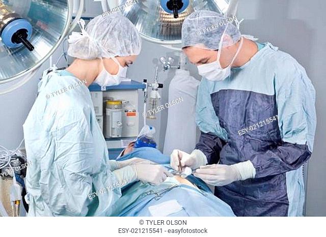 Surgeon operating the patient