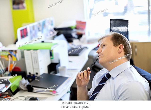 Businessman thinking at desk