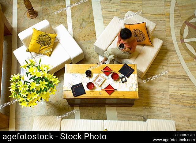 Woman sitting at a table with Asian tableware