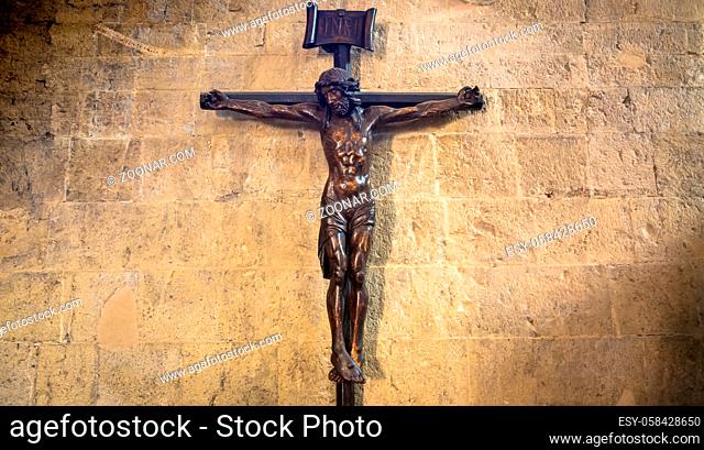Old Italian crucifix, made of wood, with Jesus Christ symbol of resurrection and salvation
